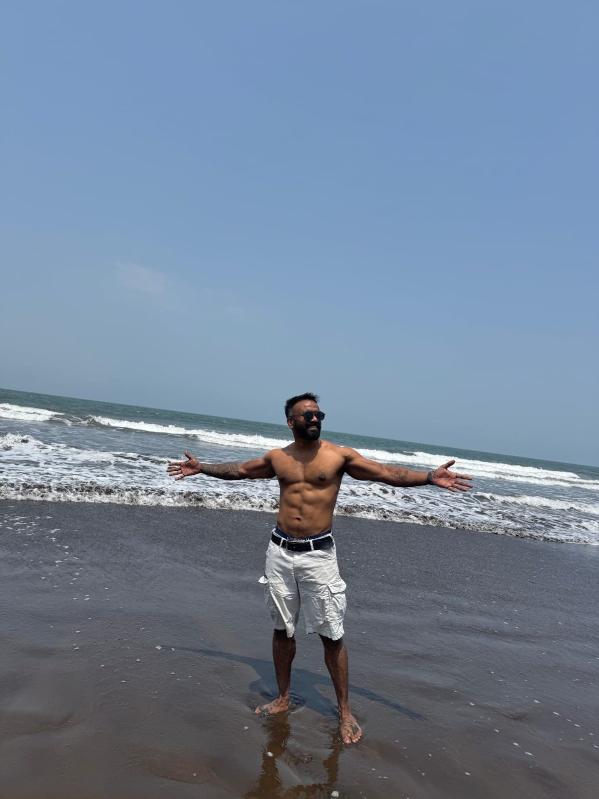 Mohit Mehral lean and athletic on the beach